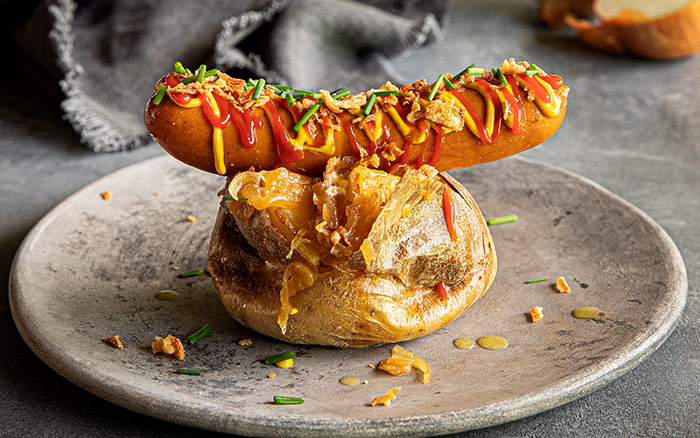 SpudULike - Action Shot - Baked Potato with Hotdog